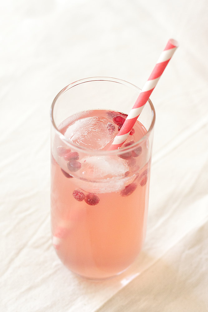 A delicious and refreshing summer recipe for pomegranate and elderflower soft drink (with homemade pomegranate syrup or cordial).