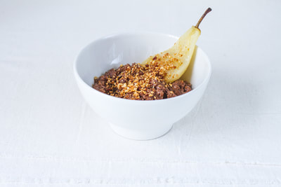 Recipe for chocolate rice pudding with poached pear and hazelnut praline